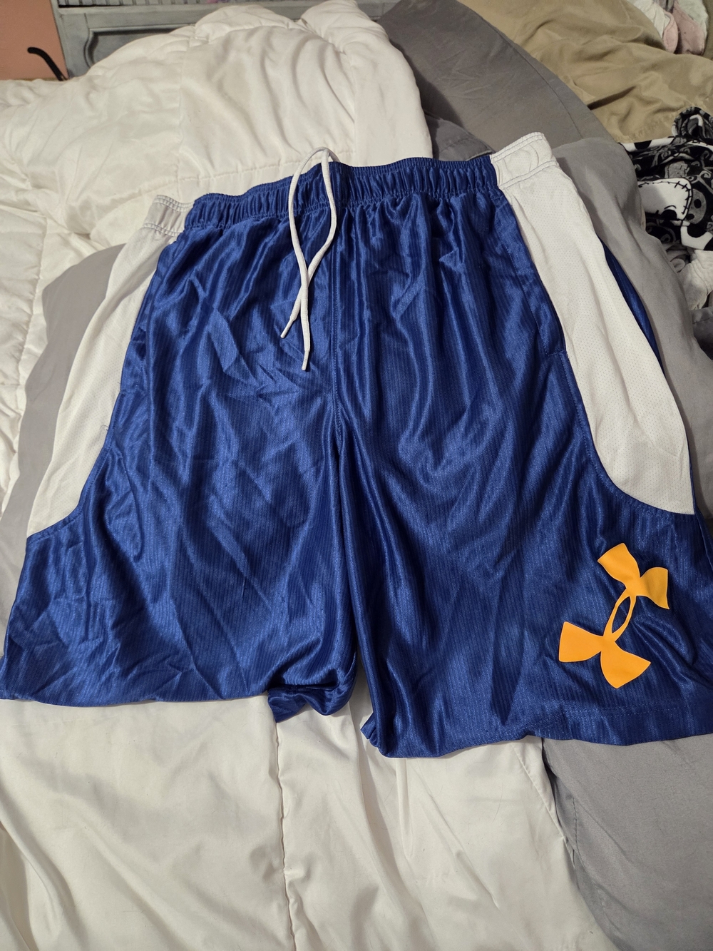 Under Armour Blue Athletic Shorts with White Panels and Orange Logo